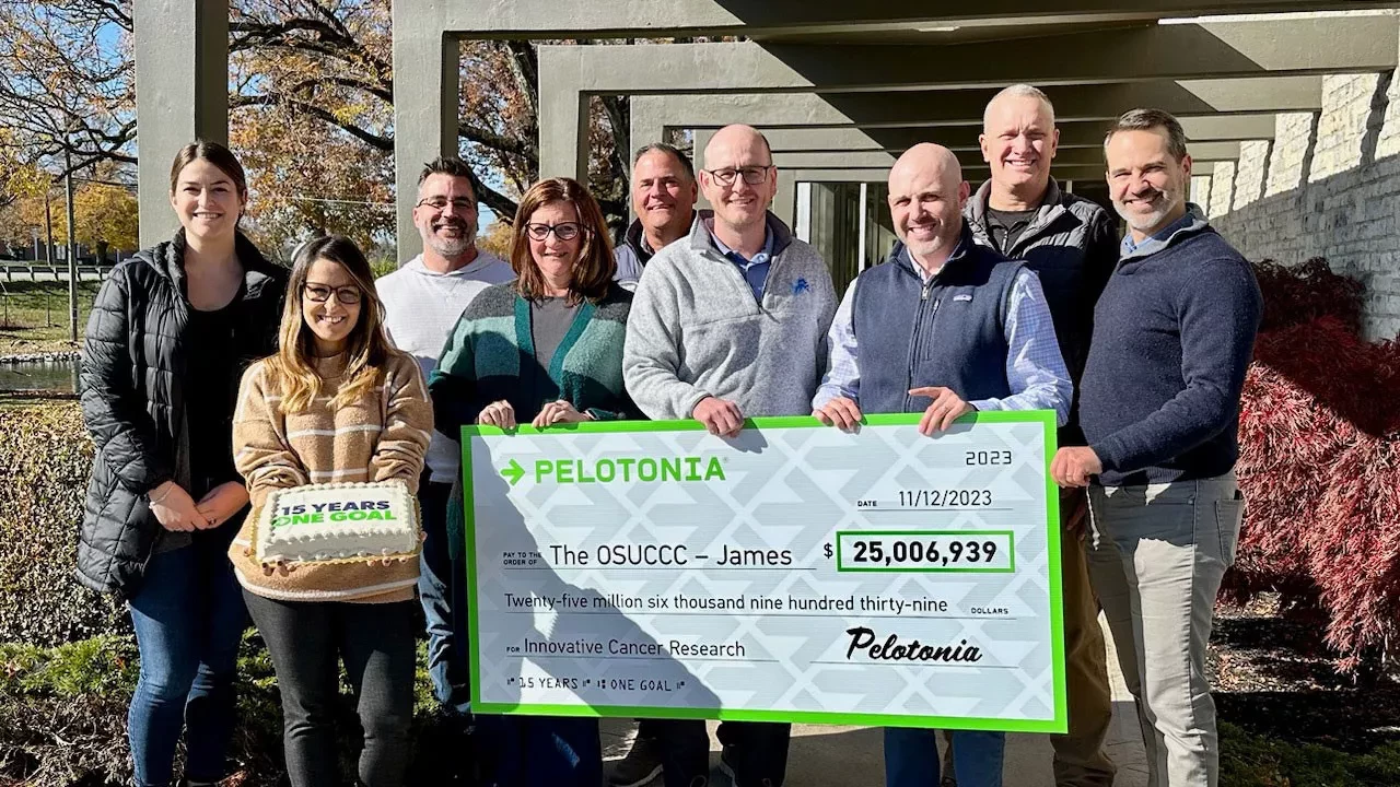 pelotonia giving check to cancer research worth $25,006,939